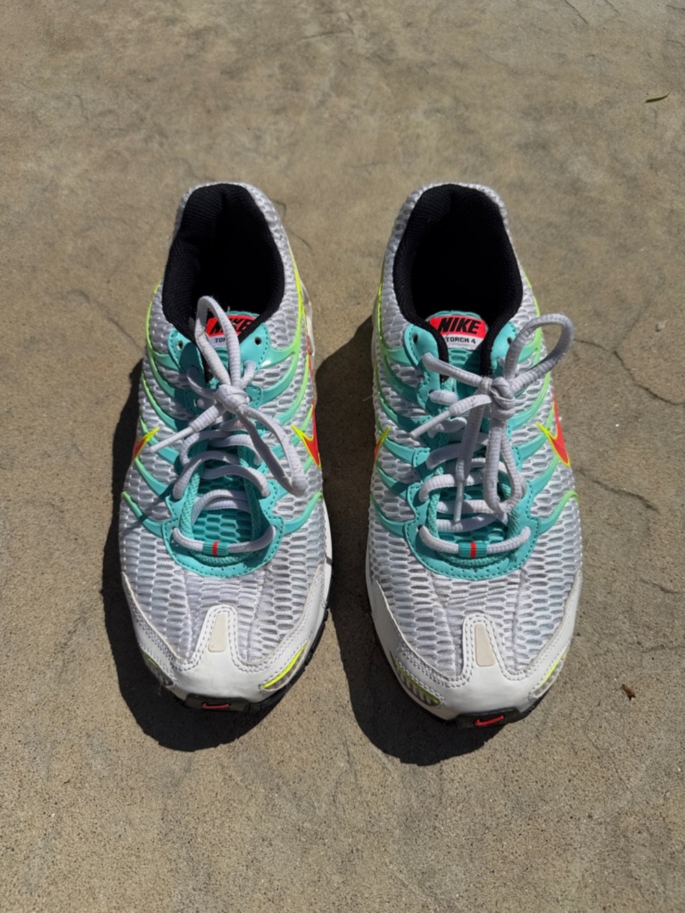 Nike White Running Shoes with Teal and Neon Accents